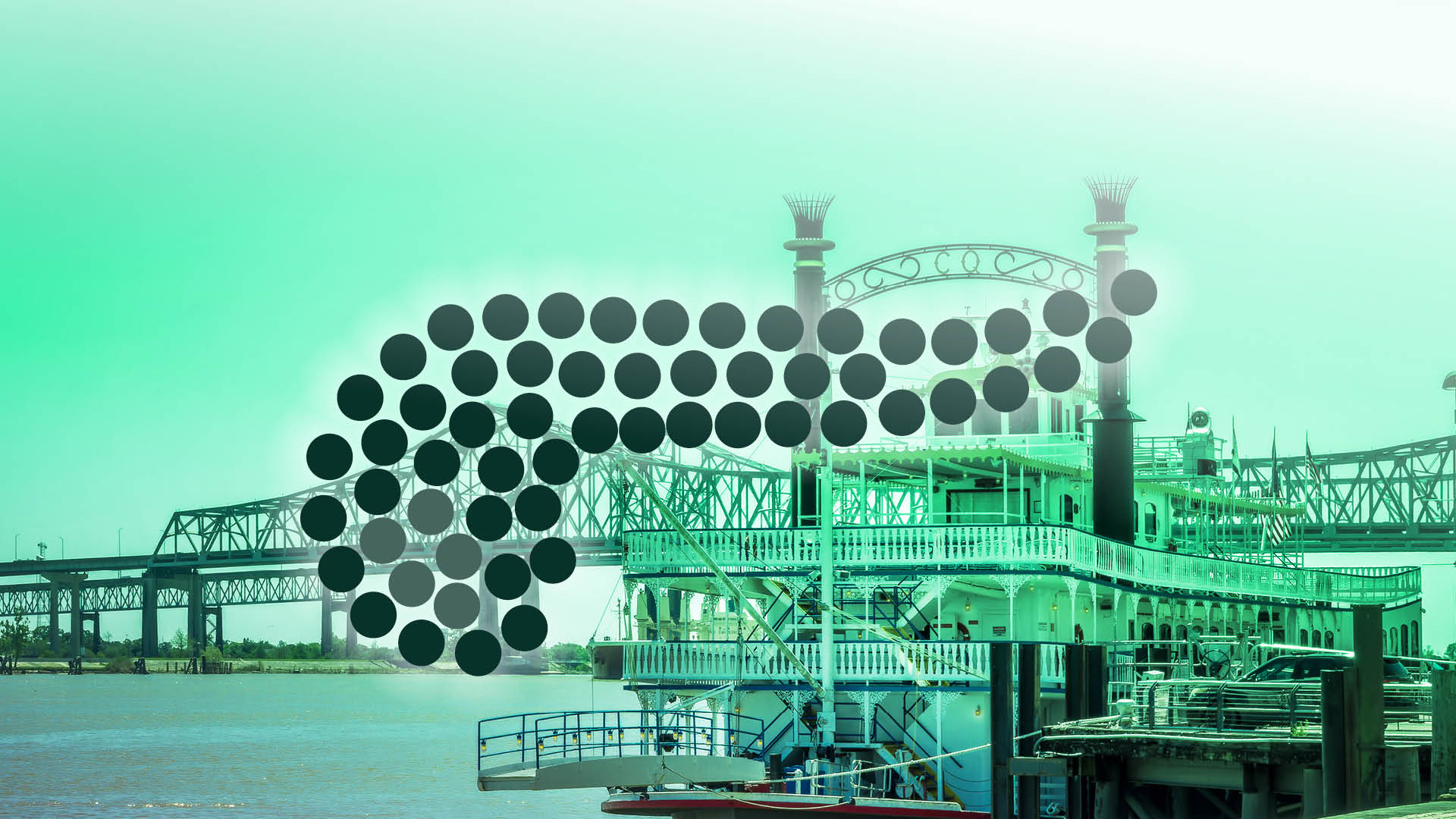 Dampfschiff auf dem Mississippi vor der Skyline von New Orleans mit Brücke im Hintergrund